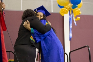 Adriana Vega/The Runner Graduating Senior Linda Forrester and Karla Young, embrace after Young awarded Forrester with her Kente Stole at the Black Graduates Recognition Ceremony, May 31.