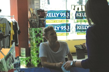 Photos by Elyse Riva/The Runners Cody Simpson signing autographs after a private show at FYE on Sunday October 13, 2013.