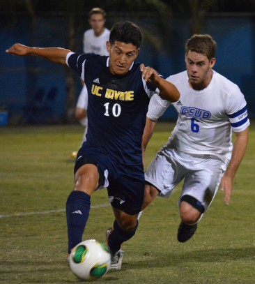 Scott Luedtke defends and oncoming Irvine player in the 'Runners' 3-0 loss on Saturday, Sept. 28.